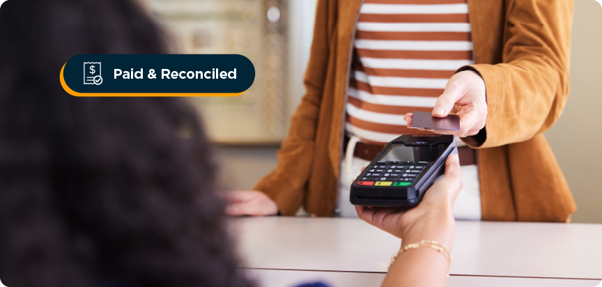 Women tapping her credit card on a payment machine