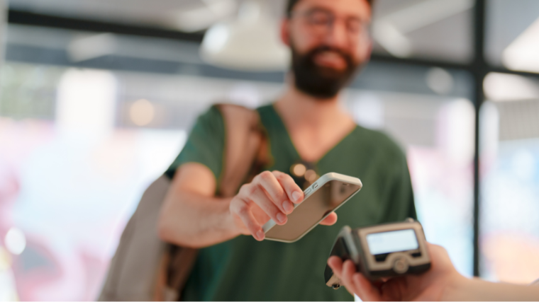man paying with his phone