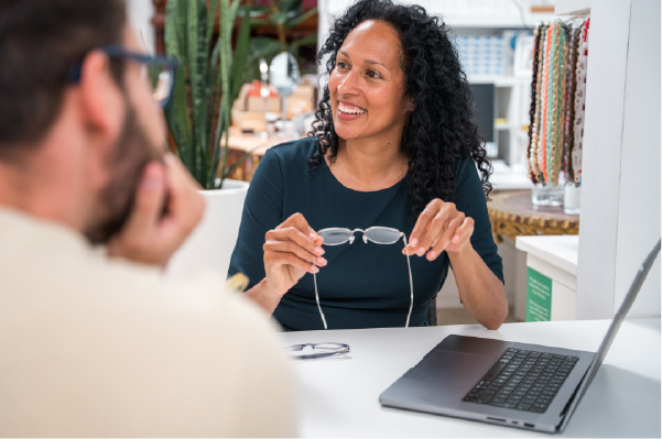 woman holding glasses