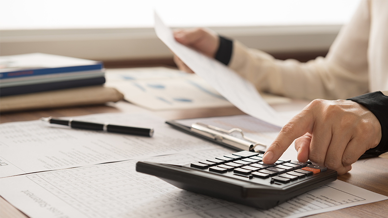 person using calculator 